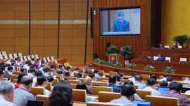 Bộ trưởng Bộ Tài chính trình bày Tờ trình về quyết toán ngân sách nhà nước năm 2024