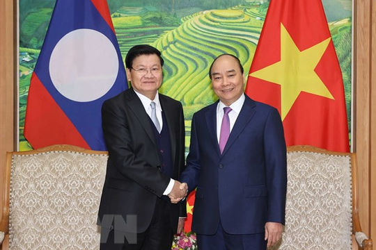 Giữ vững đà phát triển tốt đẹp của quan hệ đặc biệt Việt Nam-Lào Giữ vững đà phát triển tốt đẹp của quan hệ đặc biệt Việt Nam-Lào